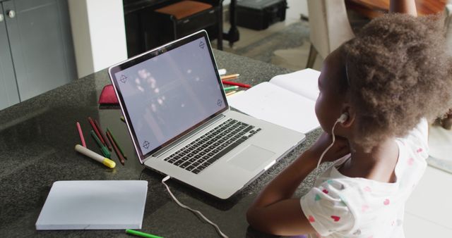 Young Girl Engaged in E-Learning with Laptop and Earphones - Download Free Stock Images Pikwizard.com