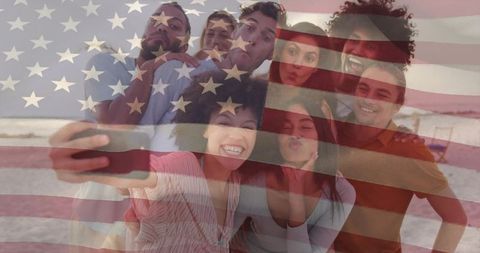Friends celebrating with selfie on beach with american flag overlay