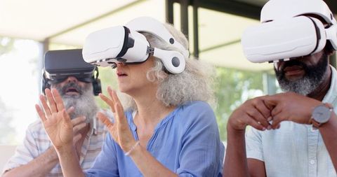 Senior Friends Engaging in Virtual Reality Experience