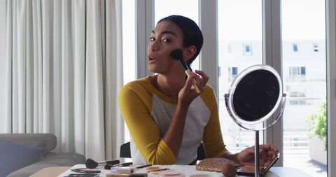 Young Woman Perfecting Makeup at Home - Download Free Stock Images Pikwizard.com