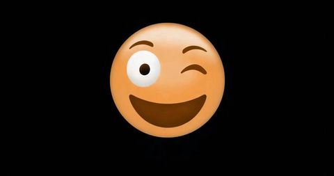Playful Grinning Emoji Face Smiling and Winking on Solid Black Background