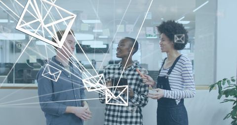 Diverse colleagues discussing networking technology at office