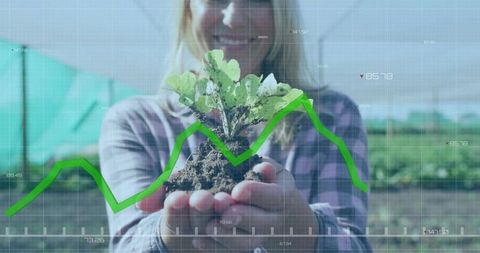 Sustainable agriculture: farmer holding seedling with growth graph overlay