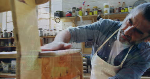 Carpenter Sanding Wood with Data Overlay