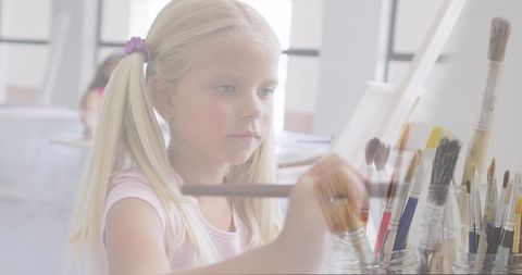 Young Schoolgirl Painting in Art Class with Brushes - Download Free Stock Images Pikwizard.com