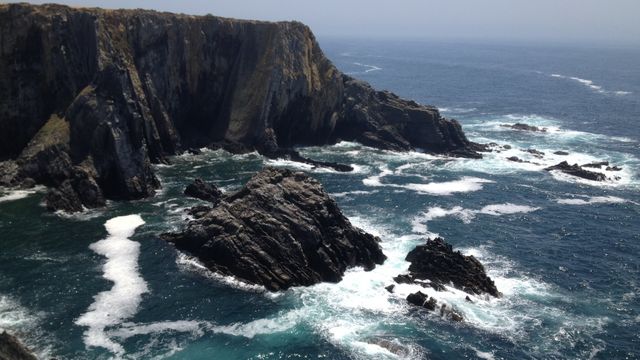 Rugged Cliffs and Rocky Coastline with Ocean Waves - Download Free Stock Photos Pikwizard.com