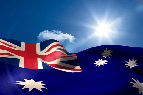 colorful australian flag featured against bright blue sky and shining sun. perfect for celebrating australian holidays, national events, or educational materials focusing on australian culture and symbols. this illustration effectively captures patriotic spirit.
