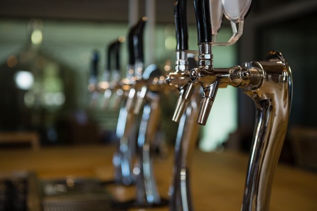 Beer taps in row at restaurant