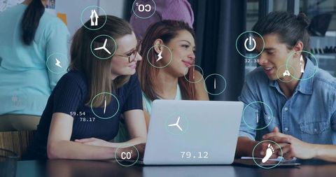 Young team collaborating on laptop with augmented reality energy and sustainability overlays