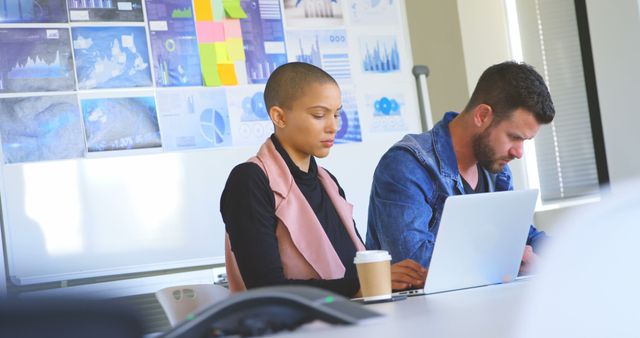 Focused business team analyzing charts in modern office meeting - Download Free Stock Images Pikwizard.com