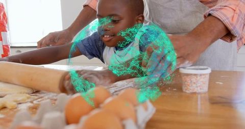 Family Baking Fun: Child Flattening Dough in Kitchen Activity