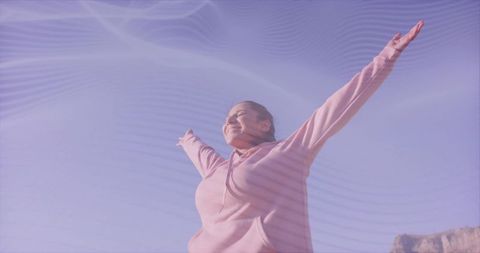 Joyful Woman Celebrating Freedom Outdoors on a Clear Day
