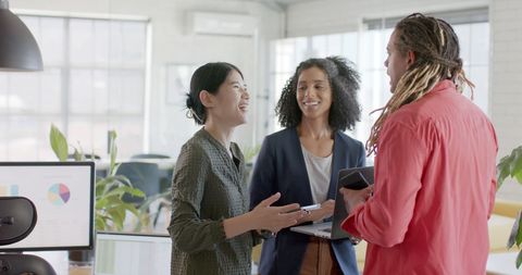 Diverse Group of Coworkers Engaging in Office Meeting - Download Free Stock Images Pikwizard.com