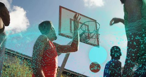 Outdoor Basketball Players Reaching for Thrilling Hoop Shot