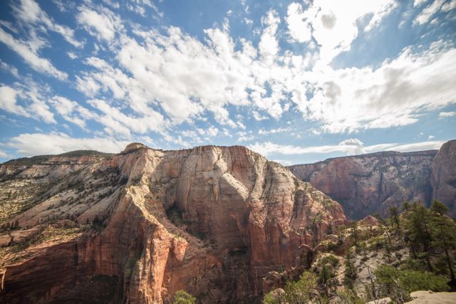 Dramatic Canyon Landscape Under Blue Sky with Clouds - Download Free Stock Photos Pikwizard.com