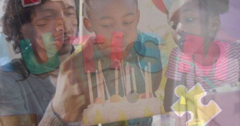 Children Blowing Birthday Candles with Puzzle and Tablet Motif