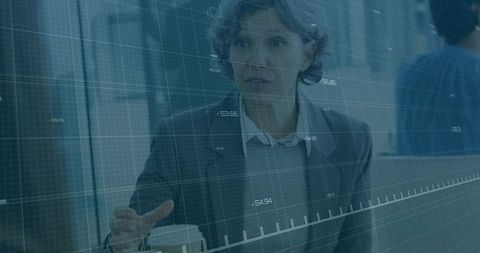 Businesswoman discussing strategy with data overlay