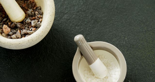 Mortars and Pestles with Coarse Salt and Spices on Dark Surface - Download Free Stock Images Pikwizard.com