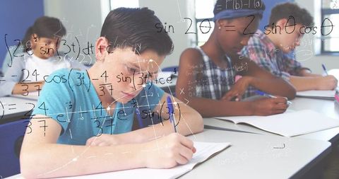 diverse students solving math problems in classroom focused on studies - Download Free Stock Images Pikwizard.com