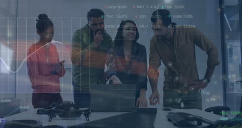 Business Team Discussing Financial Data on Laptop