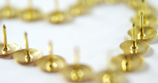 Close-Up of Gold Push Pins Arranged in Heart Shape - Download Free Stock Images Pikwizard.com