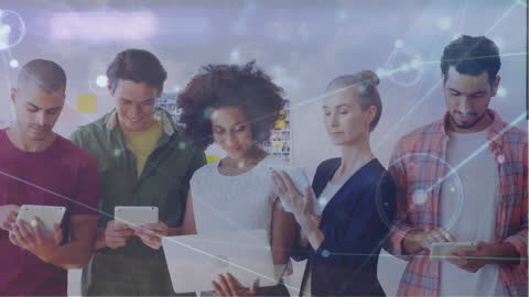 Diverse Team Collaborating on Tablets with Network Overlay