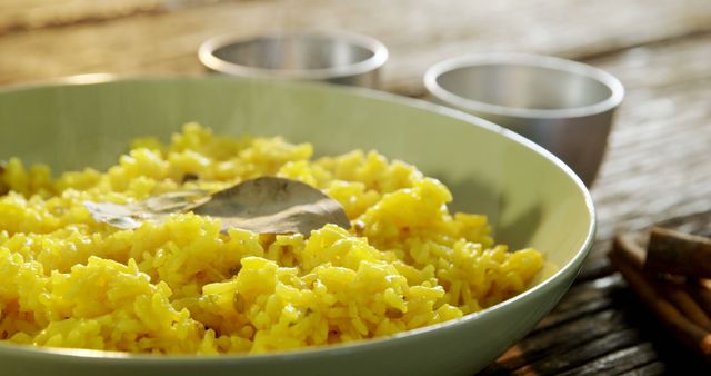 Close-up of Yellow Rice with Bay Leaf in Bowl - Download Free Stock Images Pikwizard.com