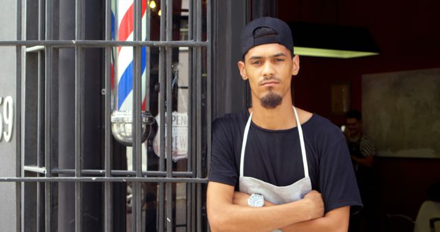 Confident Young Barber in Front of Shop Entrance - Download Free Stock Images Pikwizard.com