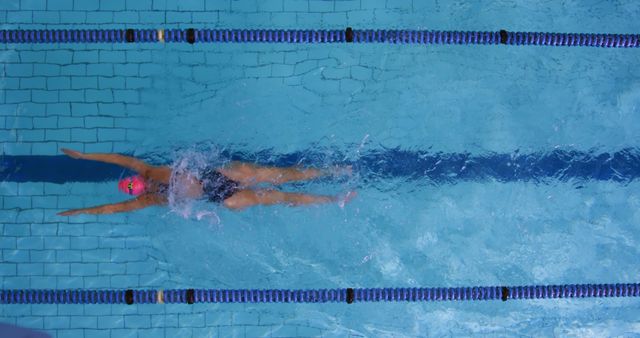 Female Swimmer Practicing Backstroke in Swimming Pool Lane - Download Free Stock Images Pikwizard.com