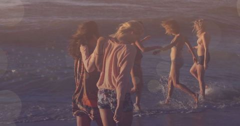 Friends Enjoying Sunset Together on Ocean Beach - Download Free Stock Images Pikwizard.com