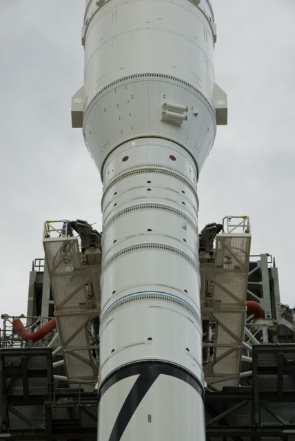 CAPE CANAVERAL, Fla. – The arms of the vehicle stabilization system are closed around the towering 327-foot-tall Ares I-X rocket, newly arrived on Launch Pad 39B at NASA's Kennedy Space Center in Florida.    The test rocket left the Vehicle Assembly Building at 1:39 a.m. EDT on its 4.2-mile trek to the pad and was "hard down" on the pad’s pedestals at 9:17 a.m.  The transfer of the pad from the Space Shuttle Program to the Constellation Program took place May 31. Modifications made to the pad include the removal of shuttle unique subsystems, such as the orbiter access arm and a section of the gaseous oxygen vent arm, along with the installation of three 600-foot lightning towers, access platforms, environmental control systems and a vehicle stabilization system.  Part of the Constellation Program, the Ares I-X is the test vehicle for the Ares I. The Ares I-X flight test is targeted for Oct. 27. For information on the Ares I-X vehicle and flight test, visit http://www.nasa.gov/aresIX.  Photo credit: NASA/Kim Shiflett