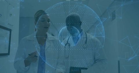 Clinicians reviewing tablet with holographic medical visualization in hospital corridor