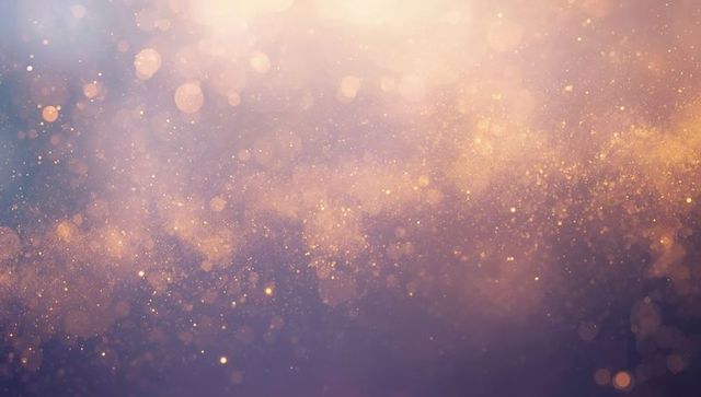 Shimmering golden bokeh dust floating over soft purple gradient ethereal glitter backdrop