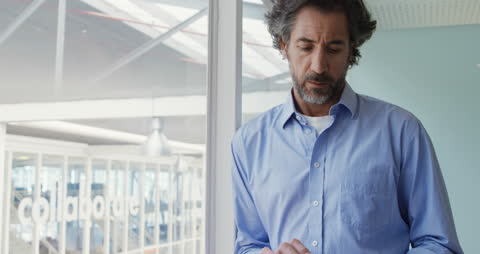 Business Executive Using a Tablet in Modern Office Environment