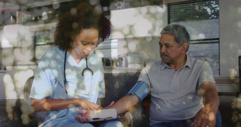 Healthcare Professional Measuring Blood Pressure of Patient at Home