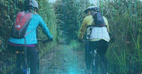 Friends cycling on woodland path amidst nature adventure