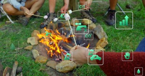 Friends roasting marshmallows on outdoor camping trip