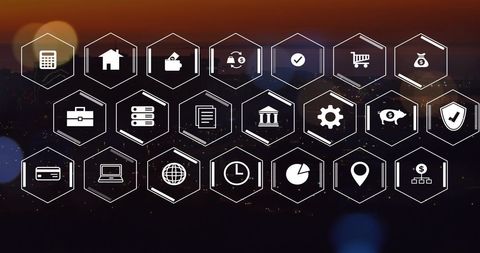 Digital Business Icons Overlaying Cityscape at Dusk