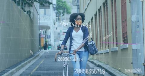 African American Woman with Bicycle in Urban Coding Environment
