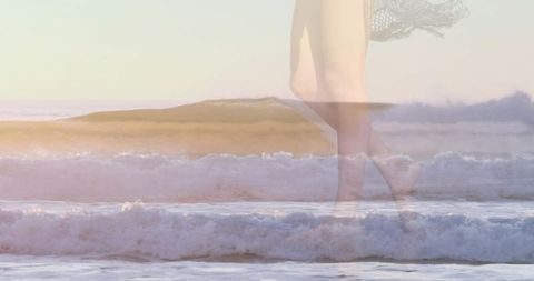 Ethereal double exposure of woman walking in pastel ocean waves with sheer crochet skirt