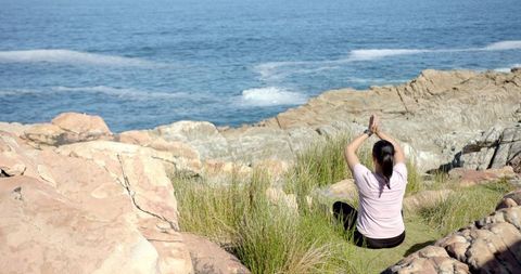 Peaceful Meditation on Cliff Overlooking Ocean
