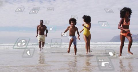 Family running and splashing on sunlit beach with floating app icons and digital overlay