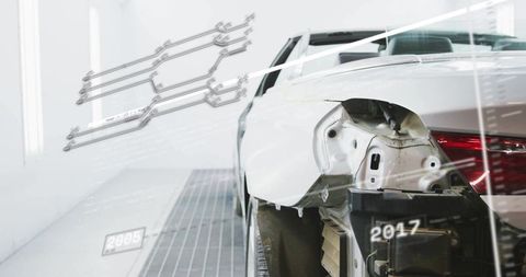 Augmented reality diagnostics showing rear sedan body repair with exposed panel and wheel