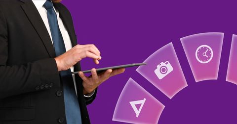 Businessman Using Digital Tablet with Technology Icons and Purple Background