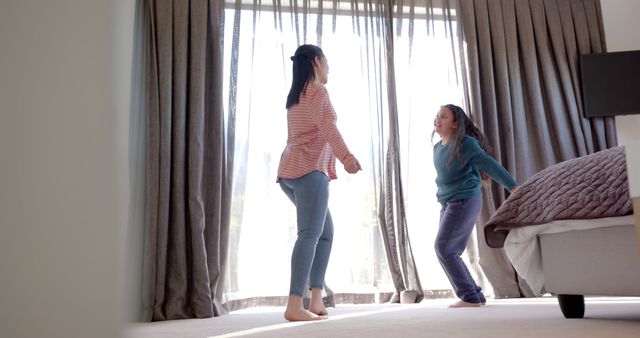 Mother and Daughter Bonding at Home Through Dancing - Download Free Stock Images Pikwizard.com