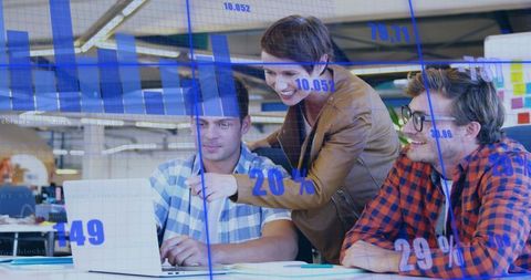 Young Team Collaborating Over Laptop With Blue Analytics Overlay in Open-Plan Office