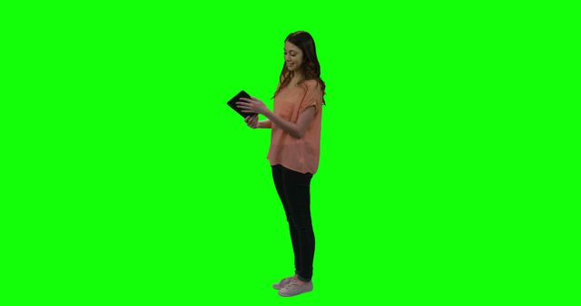 Smiling Woman Checking Tablet with Green Screen Background - Download Free Stock Images Pikwizard.com