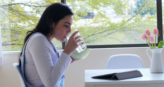 Woman Drinking Water in Relaxing Home Environment - Download Free Stock Images Pikwizard.com