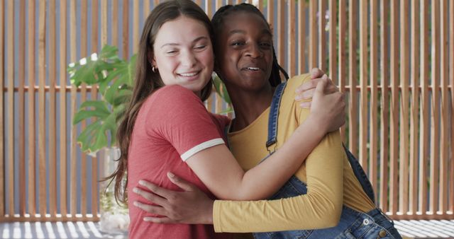 Diverse Teen Friends Embracing and Laughing Together Outdoors - Download Free Stock Images Pikwizard.com