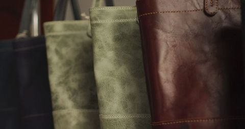 Artisan leather bags in workshop highlighting craftsmanship